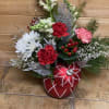 Bring festive warmth to any space with this charming holiday arrangement. Crimson