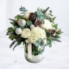 The Silverwood Arrangement captures the serene beauty of winter with an elegant