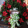 Faux Christmas wreath ready to welcome your guests.