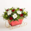 EXCLUSIVE Send holiday joy their way! Our dashing arrangement features classic Christmas-colored