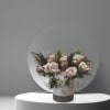 The arrangement comes in a round vase with the following floral; roses