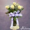 A traditional white dozen roses arranged with fancy greenery, filler flower and