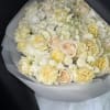 This refined arrangement features a harmonious blend of premium ivory and soft