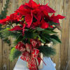 In gold cube vase decorated with white pine Christmas greens, beautiful bow