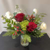 A Merry Little Christmas is a joyful, gift-sized holiday arrangement designed to