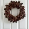 18" pine cone wreath with festive accents.  If you would like