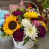 Our 6" opening baskets are filled with a standard mixture of flowers.