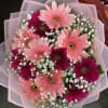 12 stems of Gerber Daisies with greenery and fillers. 
You may request