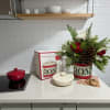 A beautiful Lennox cookie jar and lid designed with fresh evergreens and