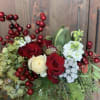 Traditional Christmas mix featuring hydrangeas, roses, berries and evergreens. 
Fresh and lively
