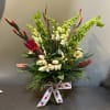 A sweet winter bouquet to brighten everyone's day!

Arrangement measures 22" tall and