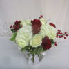 Beautiful white hydrangea interspersed with red and white roses and accented by