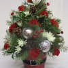 This is a fun arrangement in the design shape of a Christmas