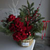Crimson Christmas &mdash; red roses and winter greens with festive accents in