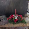 Candle, assorted pine, pinecones bows, carnations -- on the Deluxe and Premium
