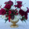 Rich crimson roses rise above soft clouds of white hydrangea, accented with