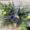 A wild and unforgettable arrangement of blue Anemone, blue Thistle, blue Veronica