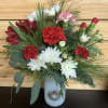 Send holiday tidings with this merry wreath jar full of beautiful carnations