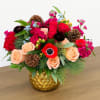 Beauty abounds in this luxurious collection of unique seasonal blooms. Arranged in