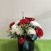 Bring the magic of Christmas to your table 
Our festive tabletop arrangement