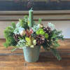 This enchanting holiday centerpiece brings warmth and natural beauty to your seasonal