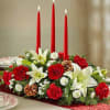 Decorate your table with this stunning oval holiday candle arrangement. Prepared using