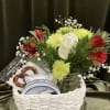 Imagine a charming small flower and snack gift basket, a delightful combination