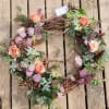 This is a elegant fall into winter grape vine wreath. Elegant roses