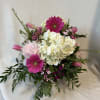 Pink gerberas, peonies, tulips, hydrangeas, and purples blended together makes you feel