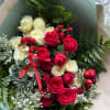 Small bouquet with beautiful spray roses, berries and greenery.