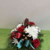 Bring the lovely of Christmas to your table
Our festive tabletop arrangement features