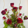 An arrangement consisting of 1 dozen roses and filler. Please keep in