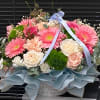Beautiful flower arrangement featuring fresh pastel flowers, mixed roses and daisy arrangement