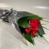 Surprise someone special with a bouquet of wrapped roses which they can