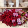  A dramatic holiday centerpiece featuring an abundant arrangement of premium red