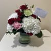Red and White Roses Carnations and Hyddrangea with Christmas Greens