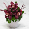 5-6 Cymbidium Orchids and hearty greens is a marble vase.  Perfect