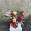 Red roses, Proteas, shimmered cypress, princess pine, other blooming fillers, and berries