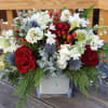 Winter flower arrangement with a pretty mix of red and white blooms