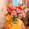 A vibrant and joyful vase arrangement featuring a beautiful mix of fresh