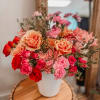 A romantic and timeless vase arrangement featuring a beautiful blend of fresh