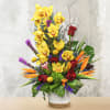 This unique design includes yellow cymbidium orchids, birds of paradise, orange lilies