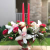 Christmas centerpiece full of fresh roses, cymbidium orchids, matsumo asters and berries