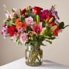 A vibrant testament to beauty, this bouquet melds the warmth of coral