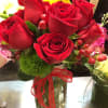 9 premium Red roses in a mason jar accented with berries when