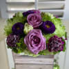Refreshing summer blooms in a green and purple palette gracefully arranged in