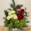 A festive holiday arrangement in a limited edition ceramic container.
