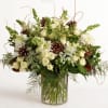 Wintersong is a serene and elegant arrangement that blends soft white blooms