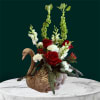 A stunning fresh floral arrangement designed in a keepsake swan symbolizing beauty