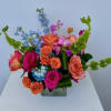 This bright a vivd arrangement packs quite a punch! Shown at premium.